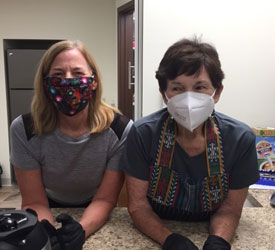 Brenda and Norma are posing for a picture with masks on at St. Nicholas Academy in Jefferson City, Missouri, during a summer 2020 program.