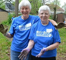Sisters work in cleaning up a garden in 2014, during the Notre Dame service day in Elm Grove, Milwaukee. 