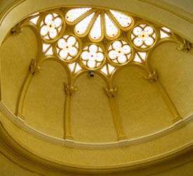 A photo of the stain glass window in the Notre Dame of Elm Grove (NDEG), Elm Grove, Wisconsin, Heritage Room. This photo is featured on the Trinity Woods, Milwaukee, campaing brochure.