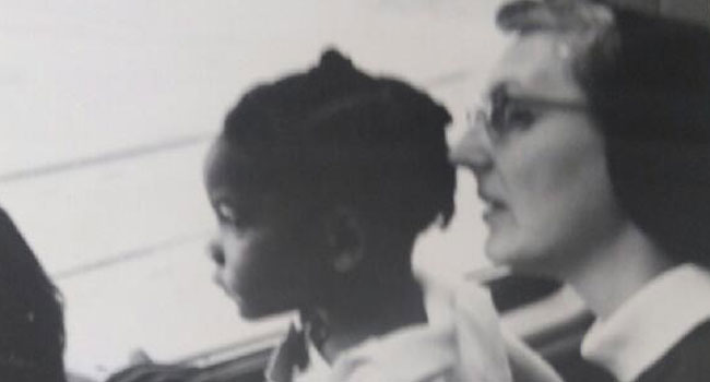 Sister Marie LeClerc Laux with an African Amercian student on a bus back in the 1960s. 