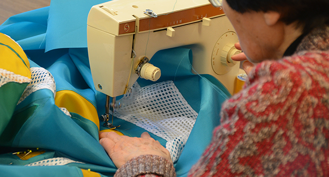 Sister Josephine Neimann working on fabric for Liturgical Fabric Arts at Sancta Maria in Ripa, St. Louis. 