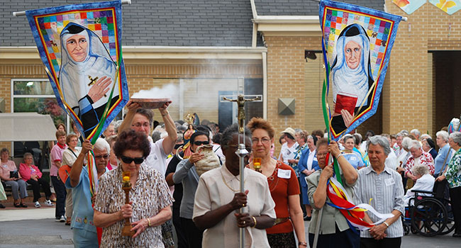 Sisters walk in a procession to Mother Caroline Friess' grave at Notre Dame of Elm Grove, Elm Grove, Wisconsin, in 2011.