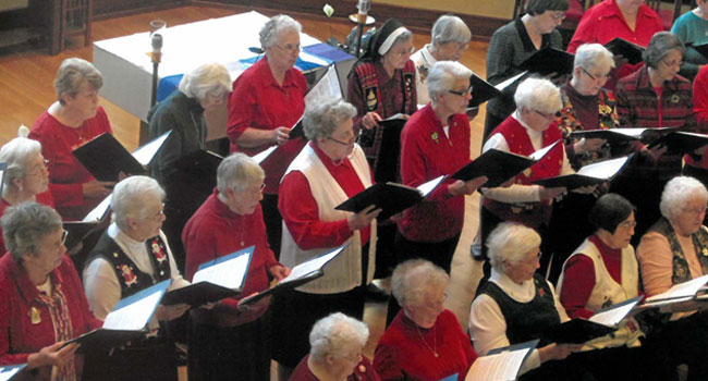 Sisters sing at a Christmas concert at The Sarah Community in Bridgeton, Missouri, in the early 2000s.