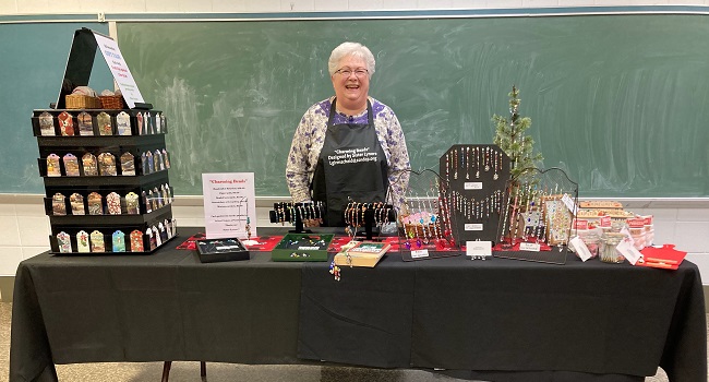 Sister Lynore Girmsheid with display of her crafts.