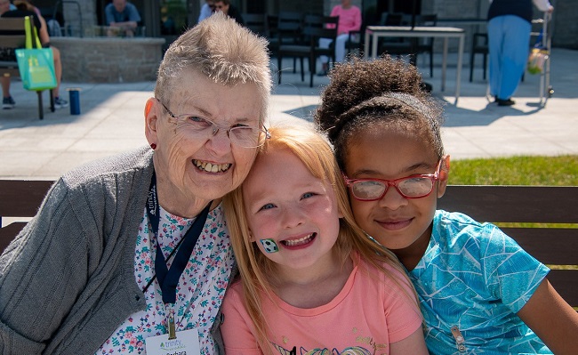 Sister Barbara Janda with two students at Rising Stars, Milwaukee