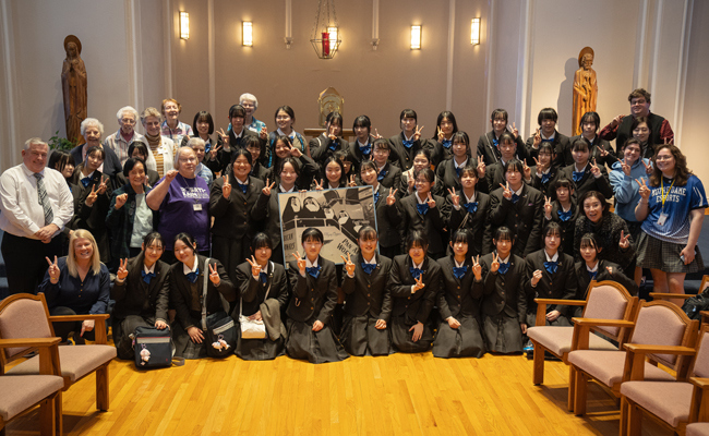 Kyoto Notre Dame University students pose alongside sisters and NDHS students and administrators during their March 2024 visit to St. Louis.