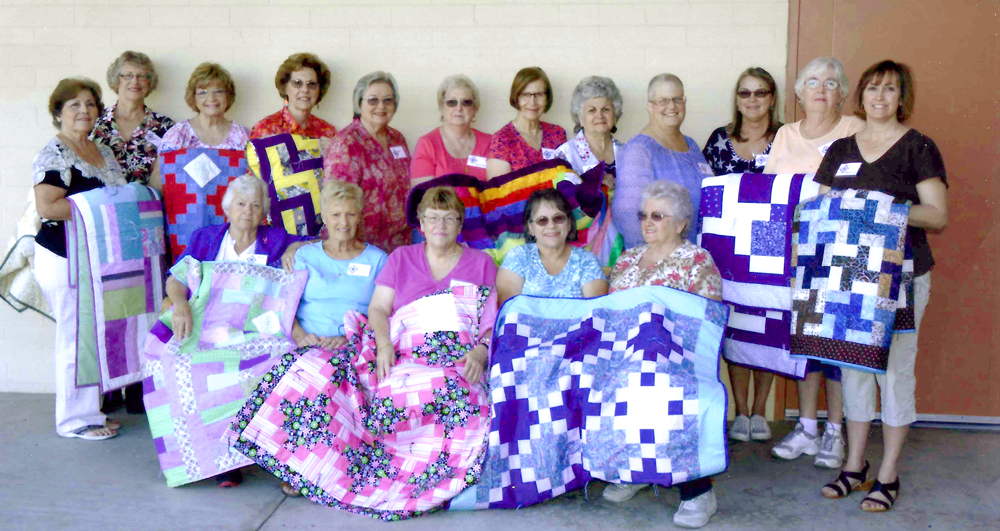 Guardian Angels Parish quilt group showing some completed projects.