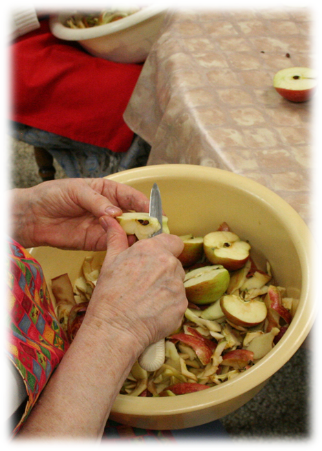 Sisters peeling apples for baking pies