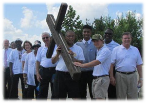 Citizens carry the cross