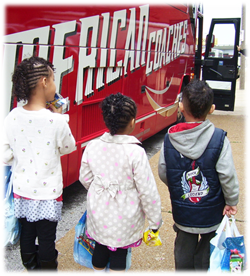 Children awaiting to board the bus to visit their mothers in prison.