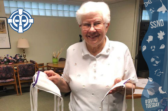Sister Annora Polega shows off the finished masks made at Notre Dame of Elm Grove, Elm Grove, Wisconsin. 
