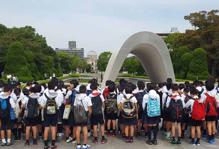 The Cenotaph for the A-bomb Victims in Hiroshima Peace Memorial Park in Naka Ward, Hiroshima, was erected in 1952. The cenotaph, in the shape of a clay figure of an ancient type of Japanese dwelling, is 4.7 meters wide at the bottom, 3.7 meters tall, and 