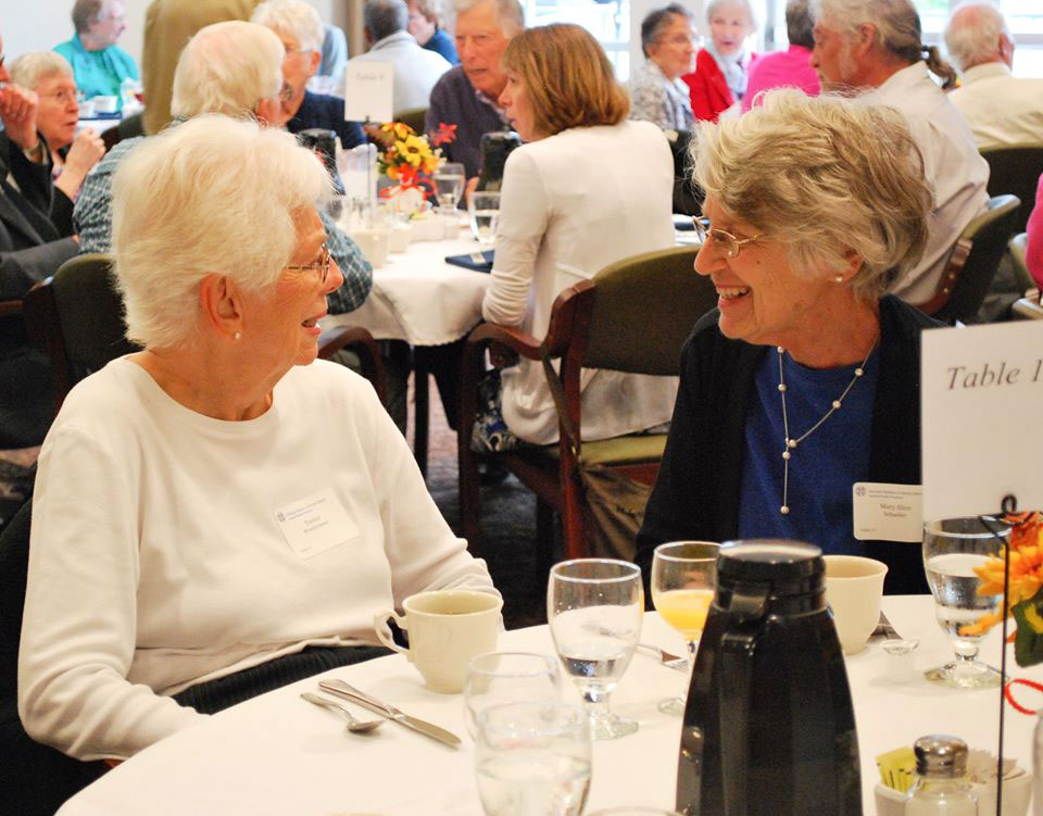 Two donors enjoy conversation during the 2019 Mass of Appreciation at Notre Dame of Elm Grove in Elm Grove, Wisconsin. 