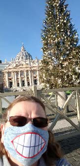 Sister Jean Greenwald posing in front of a Rome landmark with a mask during Christmas. 