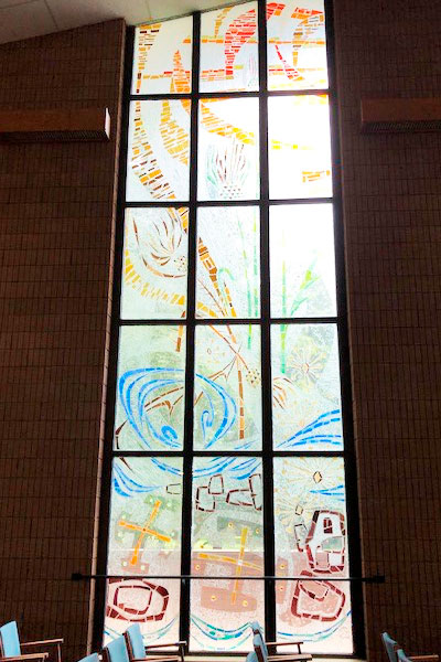 This stain glass window and another idential one were relocated from Notre Dame of Elm Grove, Elm Grove, Wisconsin, was taken to the chapel at Trinity Woods. 