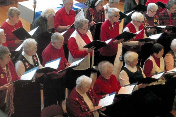 Sisters sing at a Christmas concert at The Sarah Community in Bridgeton, Missouri, in the early 2000s.