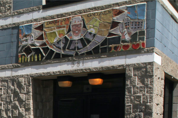 This is a mosaic image of Sister Giovannie Gourhan, which was  built into the wall above the entrance to GAP school. 