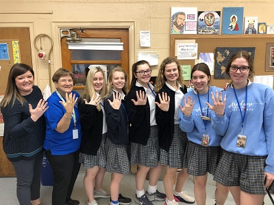 Sister Jan Berberich with Katie Wood, left, head of Student Life and 2020 graduates of Notre Dame High School (NDHS), St. Louis, holding up their NDHS class rings. 