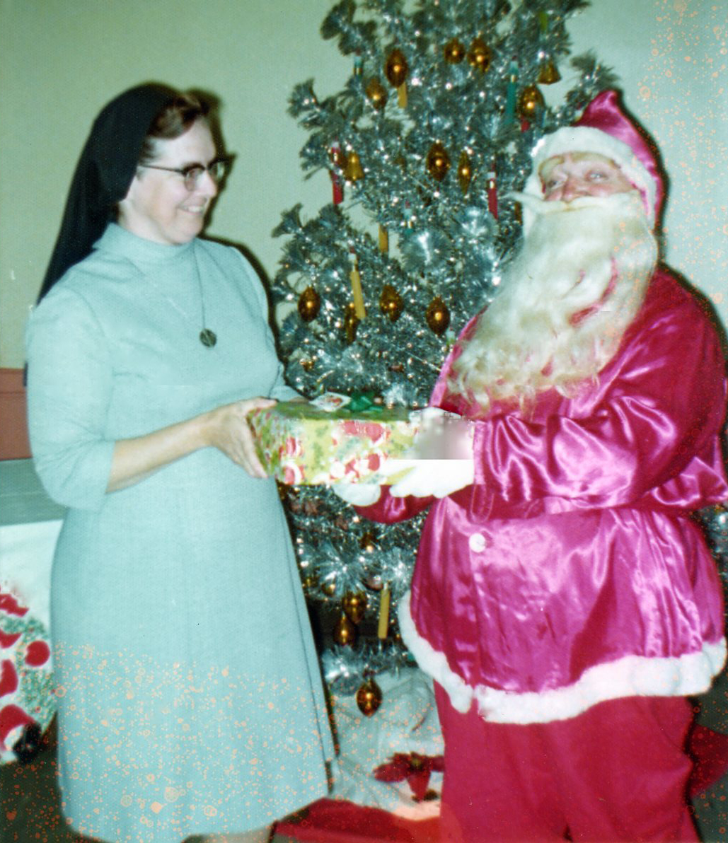 Sister Gertrude Marie Hagen with Santa at Christmas