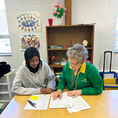 A student and sister work together during a tutoring session at Good Counsel Learning Center 